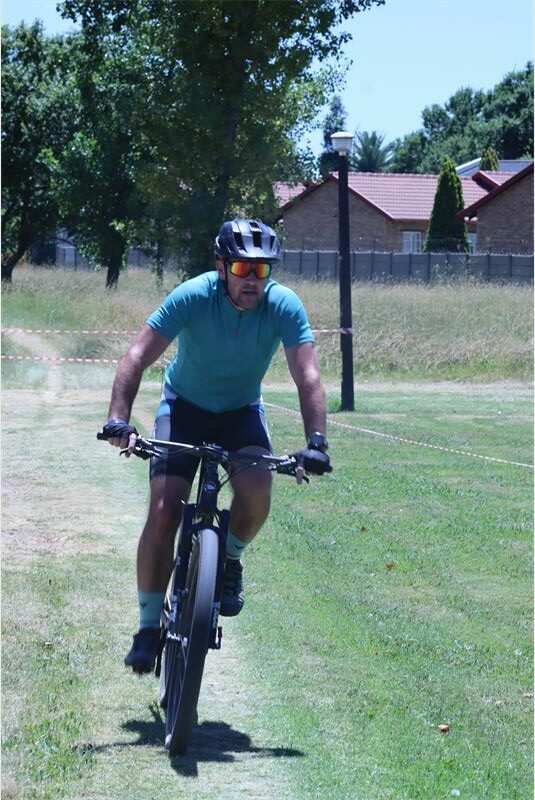 a cyclist wearing aqua