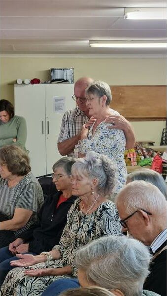 elderly people in the midst of prayer