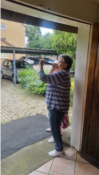 Woman blows on the shofar