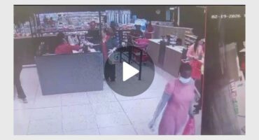 a woman in a pink dress in a shop