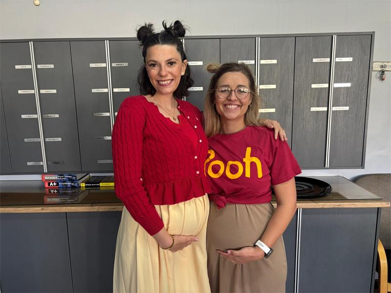 two women dress as winnie the pooh