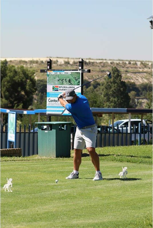 a golf player hits the ball