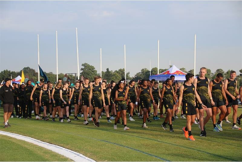 athletes walk onto field