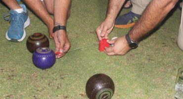 people measure distance of bowls