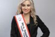 blonde woman with a sash