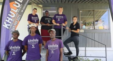 Seven people with purple t shirt