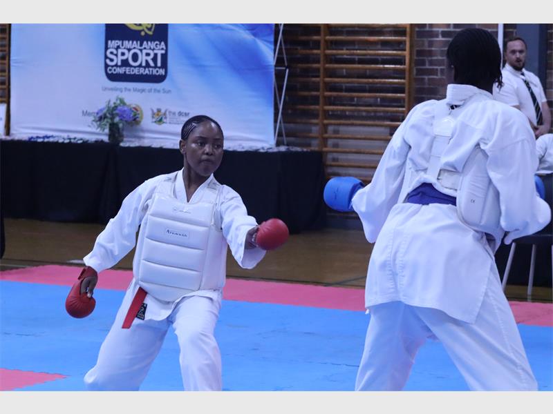 a girl with a body suit fight against an opponent