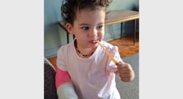 little girl with a cast on her arm