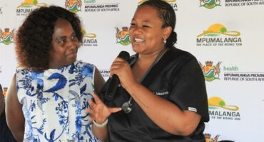 two women with a microphone