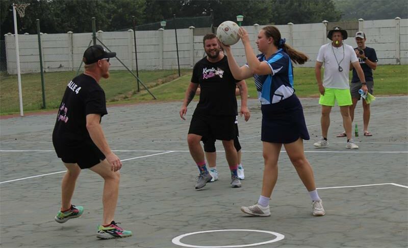 girl has ball during a ring ball game