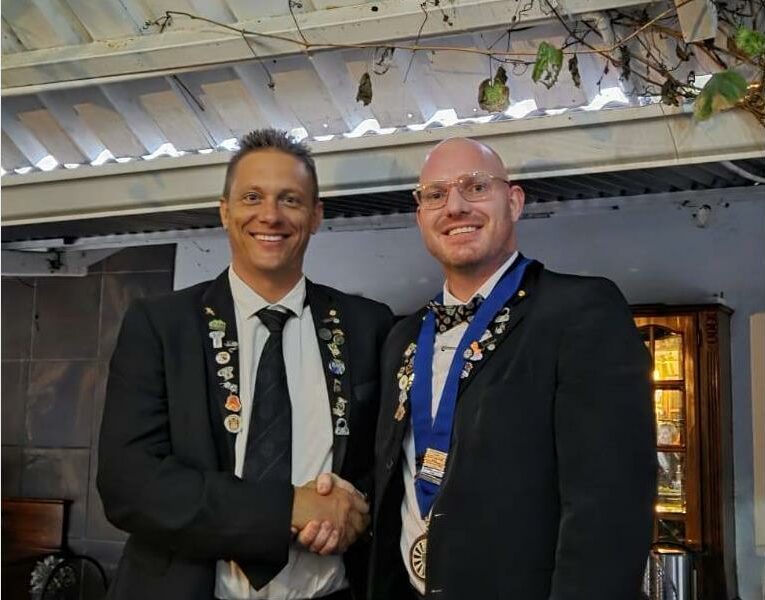 two men with many medals