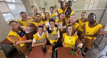 group of kids in yellow bibs