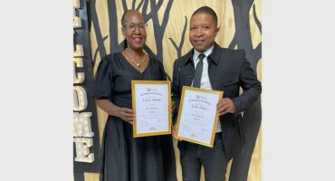 two people with certificates