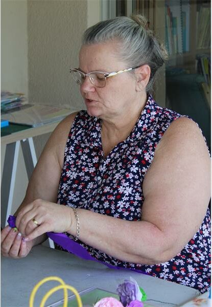 a woman folds paper