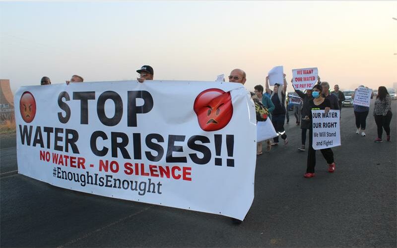 people walking with a banner