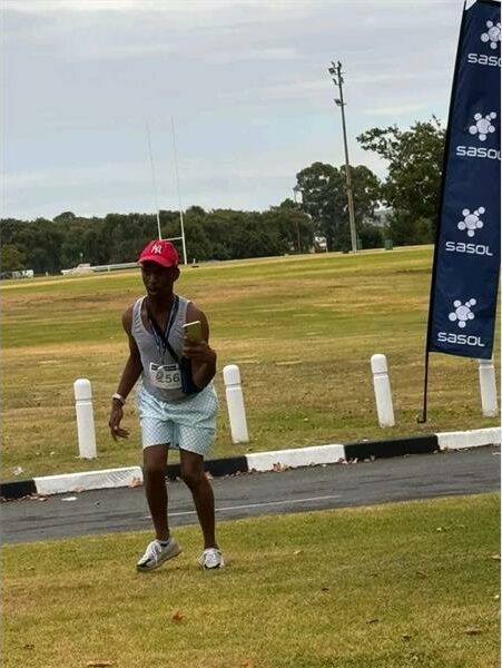 disabled man runs on grass