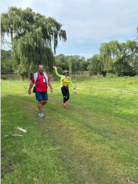 two people walking in the park