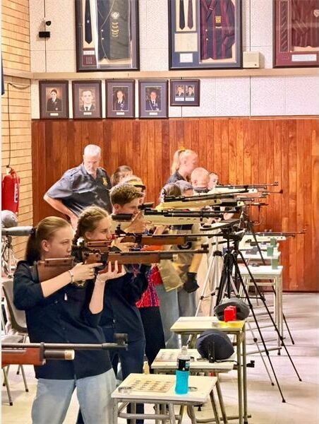 girls take aim with rifles