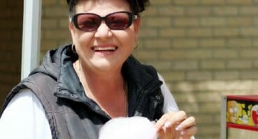woman eating candyfloss
