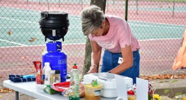 a woman prepairs food