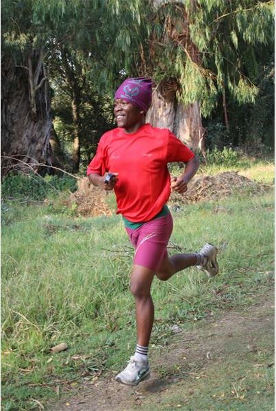 boy with red shirt and purple bandana on his head