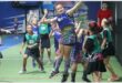 a girl humps in the air while playing netball