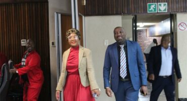 a man and a woman in formal attire