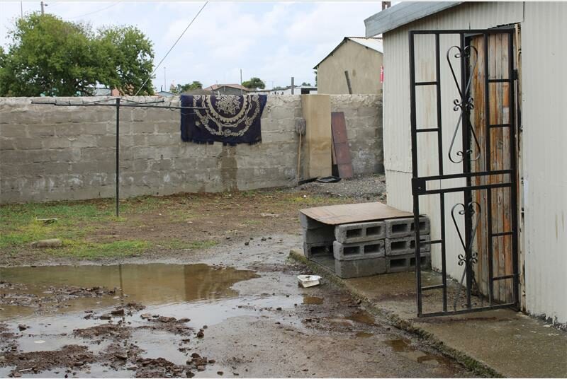 sewage in the back yard of a house