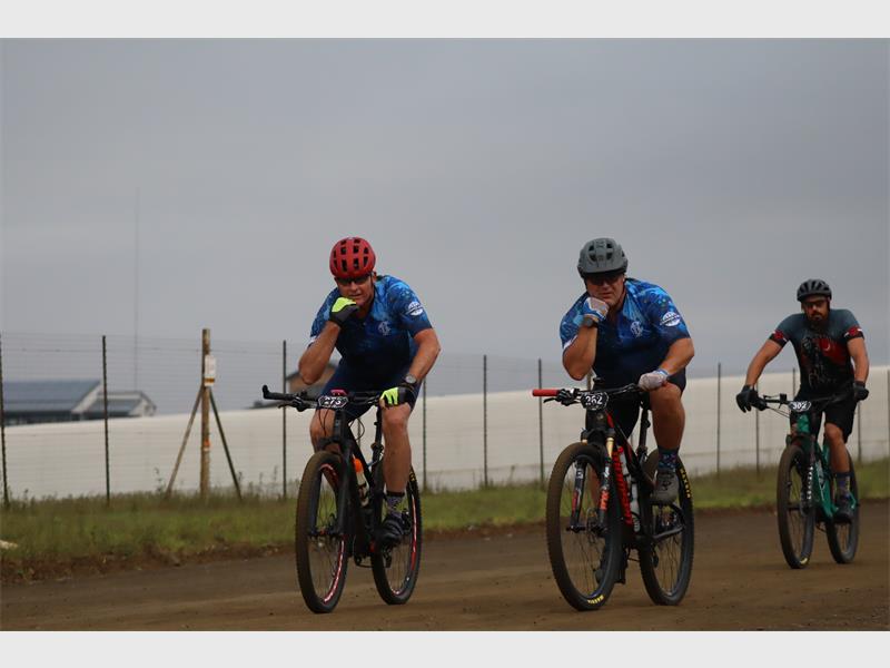 Two cyclists pose for the camera