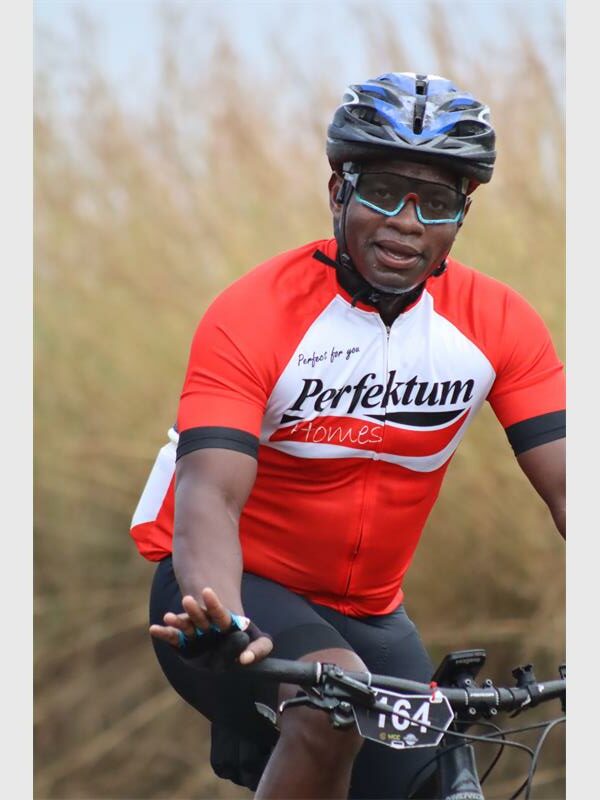 a man cycles in a perfektum shirt
