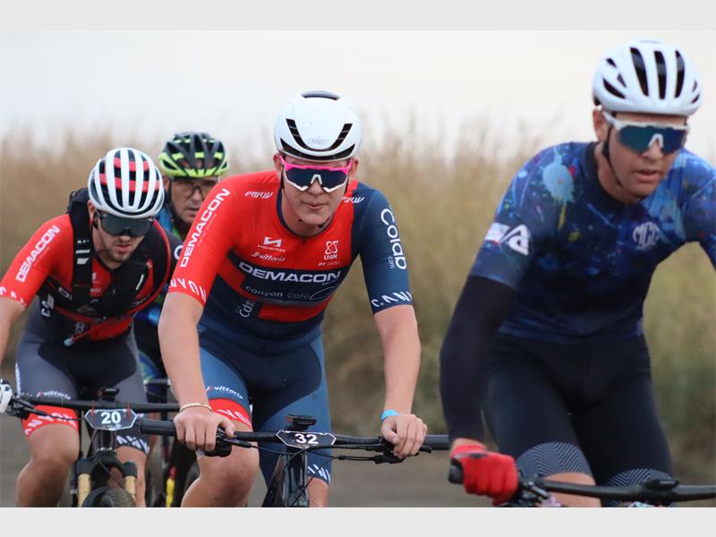 cyclists peddle in a group
