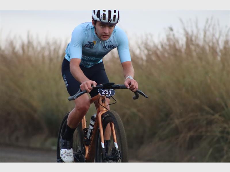 a cyclist wearing powder blue shirt