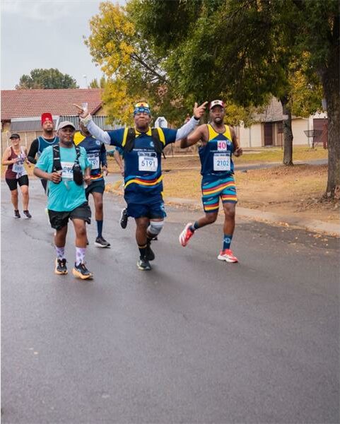 group of people taking part in a road race