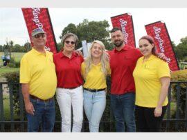 five people in yellow or red shirts