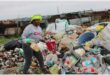 a woman sorts out trash