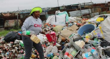 a woman sorts out trash