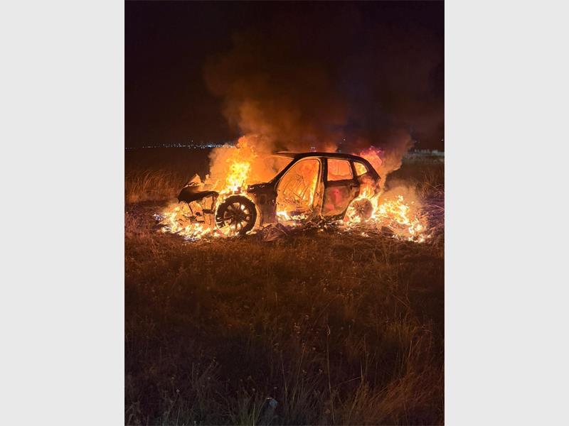 a car is hulled in flames
