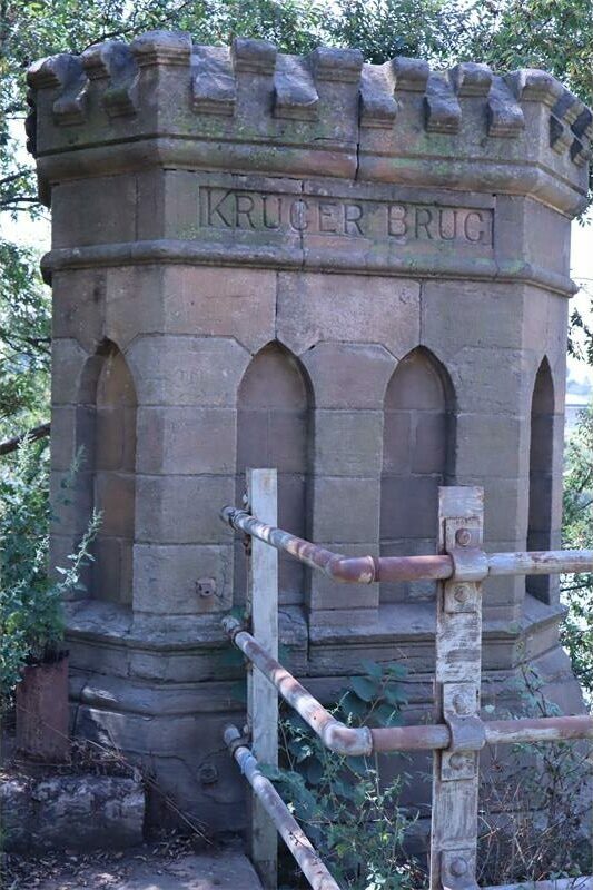 a monument next to a bridge
