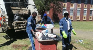 municipal workers removing refuse