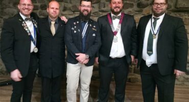 five men in formal wear