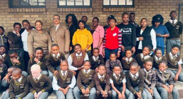 large group of school learners and their teachers