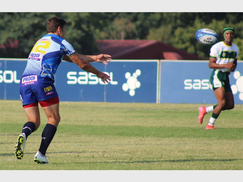 rugby player in blue with rugby ball