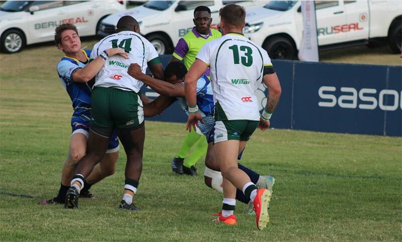 rugby player in blue with rugby ball