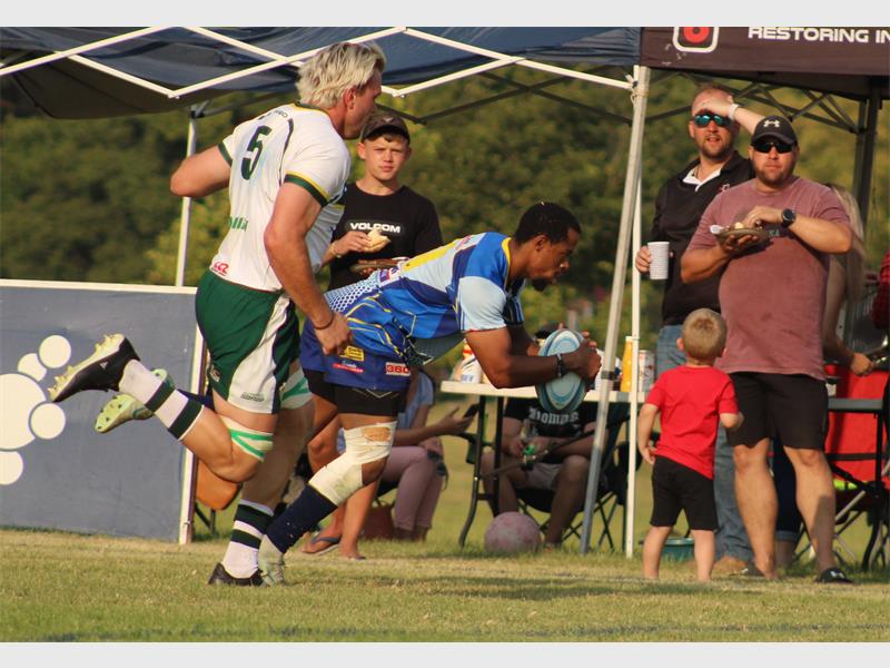 rugby player in blue with rugby ball