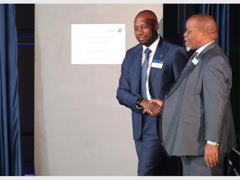 two men shake hands
