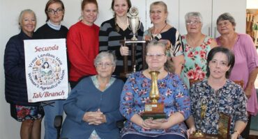 group of women with trophies