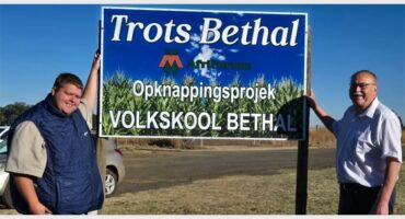 two men by a bill board