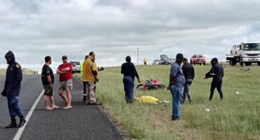 people standing on an accident scene