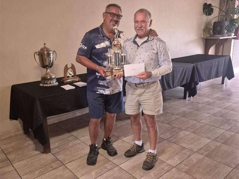 two men with a trophy