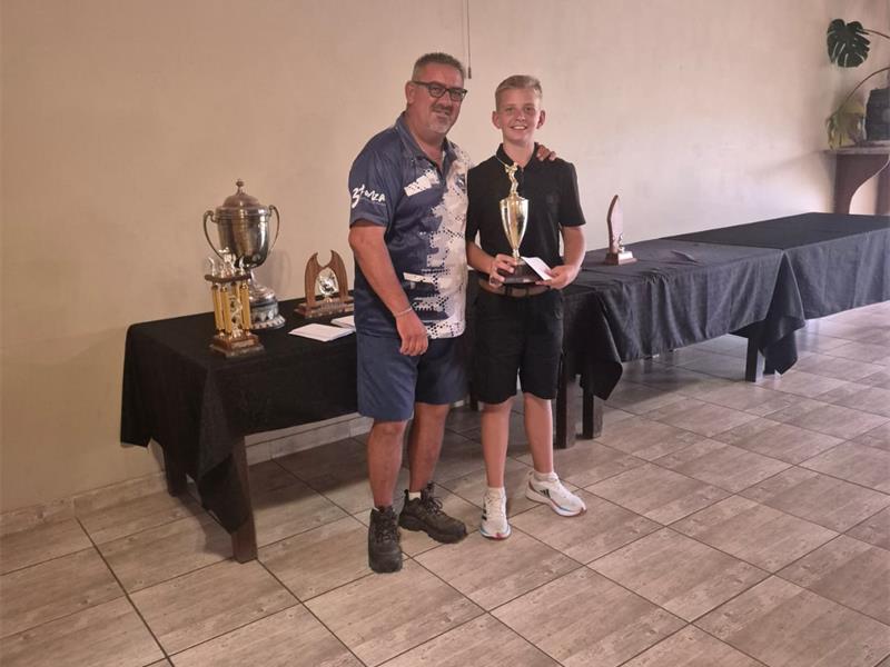 two men with a trophy